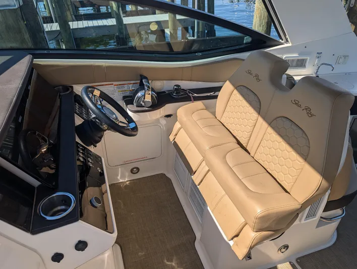  Yacht Photos Pics 2019 Sea Ray Sundancer 320 cockpit with beige leather seats and modern controls.
