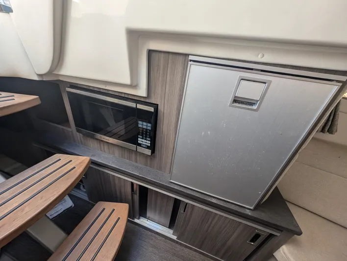  Yacht Photos Pics 2019 Sea Ray Sundancer 320 interior with microwave and compact fridge.