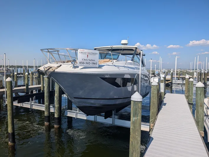  Yacht Photos Pics 2019 Sea Ray Sundancer 320 docked at marina under clear blue sky.