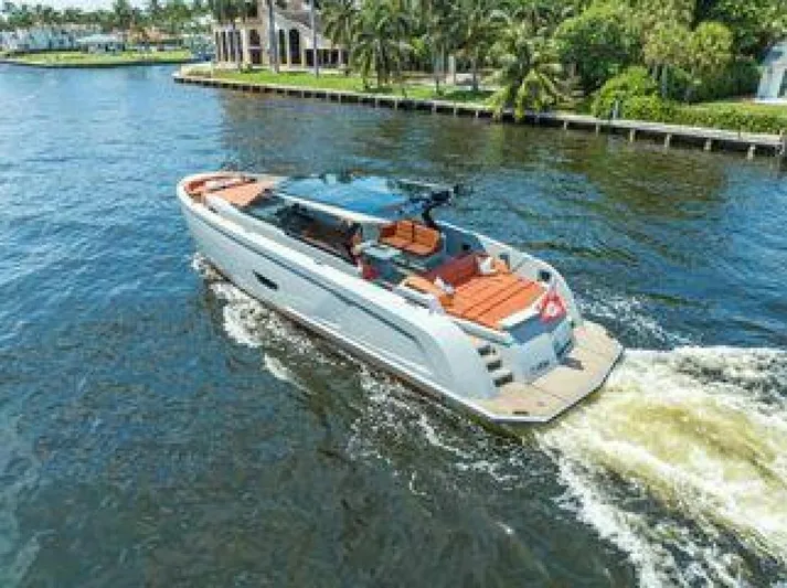 Incentivized Yacht Photos Pics Luxury Vanquish VQ58 yacht cruising on a sunny waterway, 2021 model.