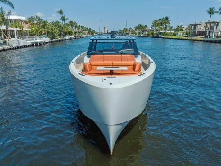 Incentivized Yacht Photos Pics Luxury 2021 Vanquish VQ58 yacht cruising on a scenic waterway.