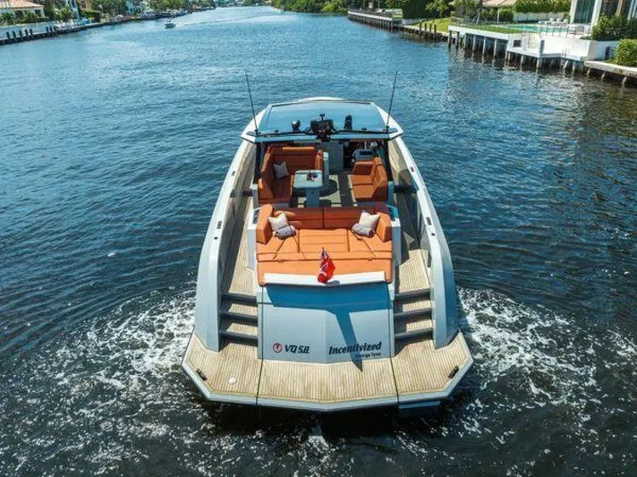 Incentivized Yacht Photos Pics Luxury Vanquish VQ58 yacht cruising on a scenic waterway, 2021 model.