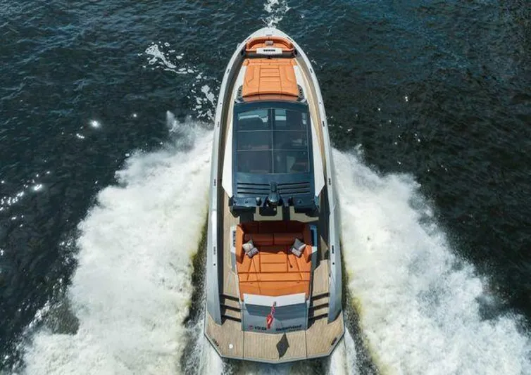 Incentivized Yacht Photos Pics Aerial view of 2021 Vanquish VQ58 yacht cruising on water.
