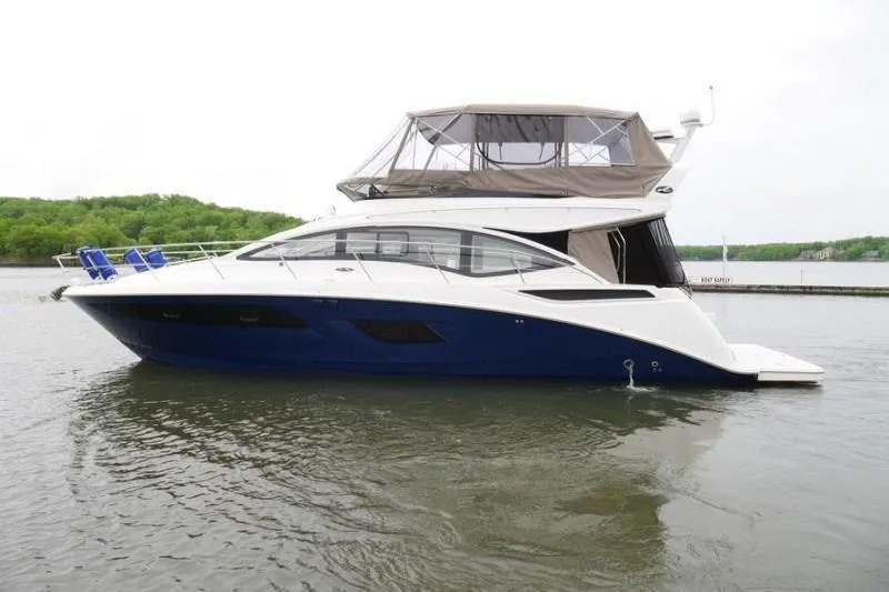 Necessity Yacht Photos Pics 2017 Sea Ray Fly 400 yacht on calm water, side view.
