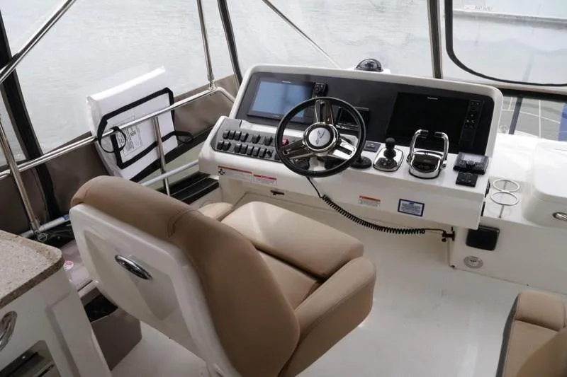 Necessity Yacht Photos Pics 2017 Sea Ray Fly 400 helm with modern controls and comfortable seating.