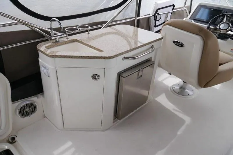 Necessity Yacht Photos Pics 2017 Sea Ray Fly 400 yacht interior with kitchenette and seating area.