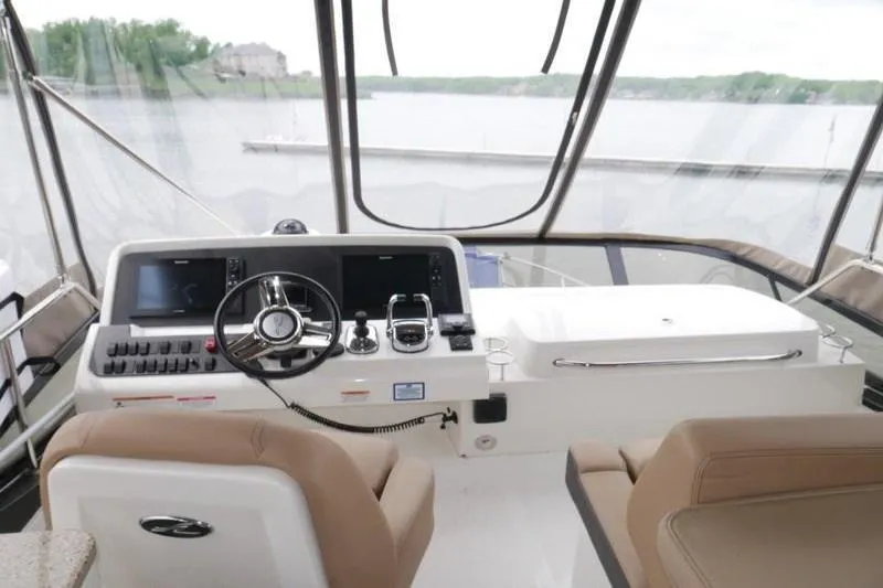 Necessity Yacht Photos Pics 2017 Sea Ray Fly 400 yacht helm with modern controls and panoramic water view.