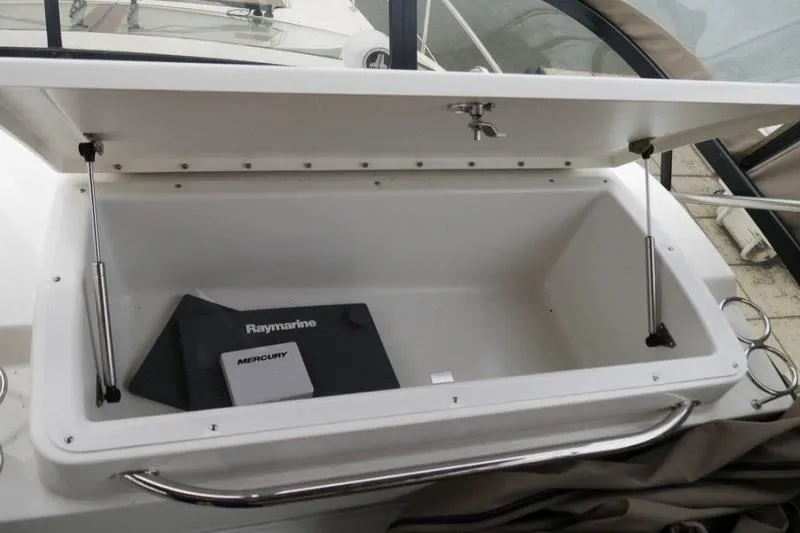 Necessity Yacht Photos Pics Open storage compartment on 2017 Sea Ray Fly 400 boat with manuals inside.