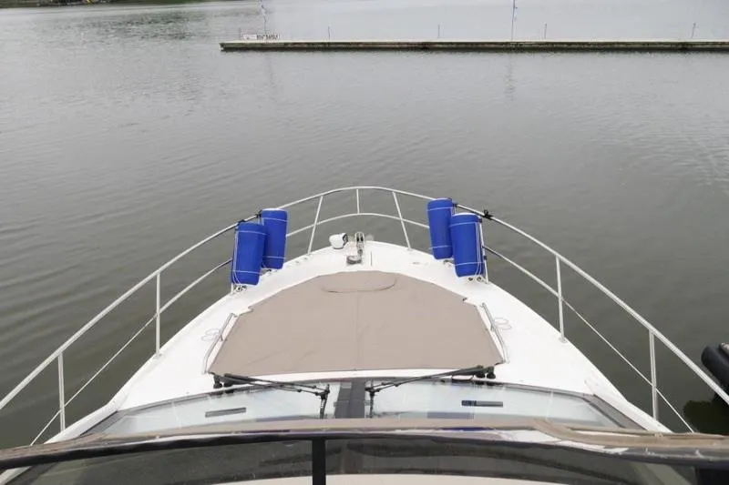 Necessity Yacht Photos Pics Bow view of 2017 Sea Ray Fly 400 yacht on calm water.