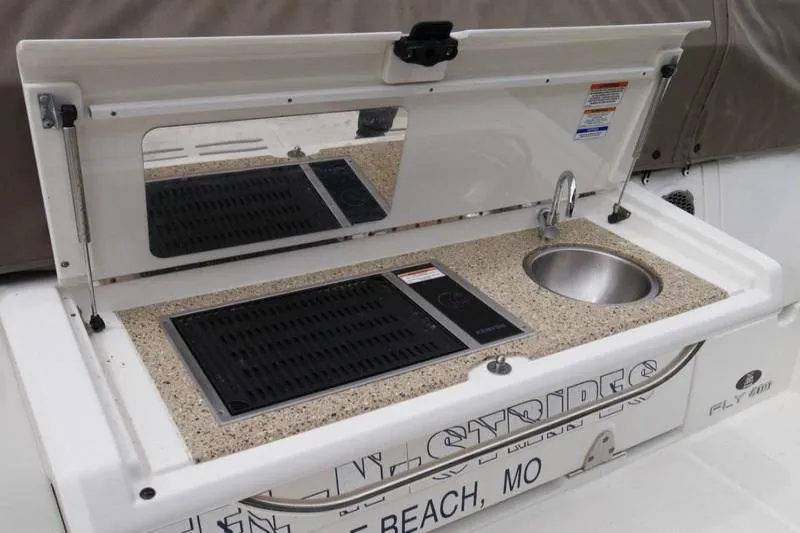 Necessity Yacht Photos Pics Outdoor kitchenette on 2017 Sea Ray Fly 400 yacht with grill and sink.
