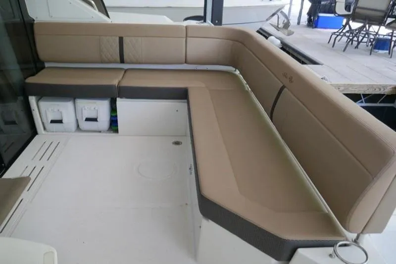 Necessity Yacht Photos Pics 2017 Sea Ray Fly 400 yacht with spacious beige seating area on deck.