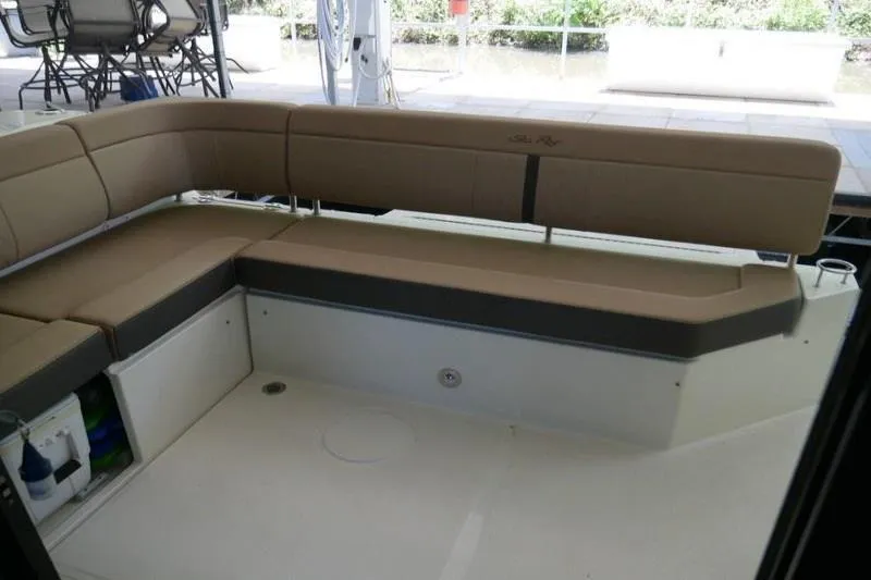 Necessity Yacht Photos Pics 2017 Sea Ray Fly 400 boat interior with beige seating and storage compartments.