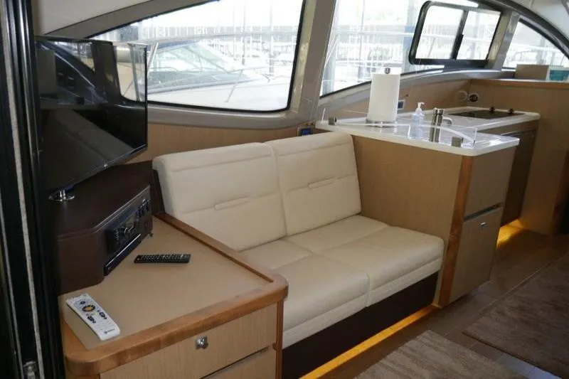 Necessity Yacht Photos Pics Interior of 2017 Sea Ray Fly 400 yacht with beige seating and modern amenities.