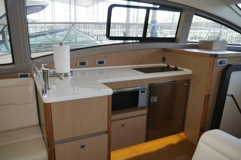 Necessity Yacht Photos Pics 2017 Sea Ray Fly 400 yacht interior kitchen with modern appliances and sleek design.