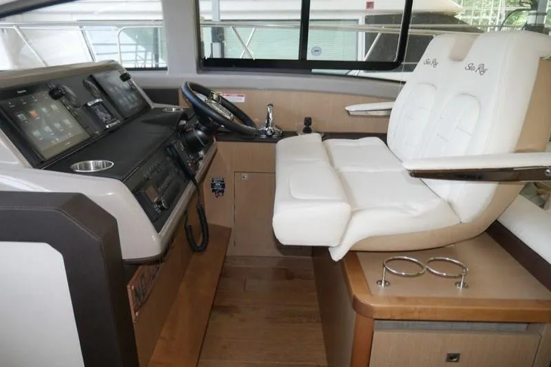 Necessity Yacht Photos Pics 2017 Sea Ray Fly 400 helm with modern controls and comfortable seating.
