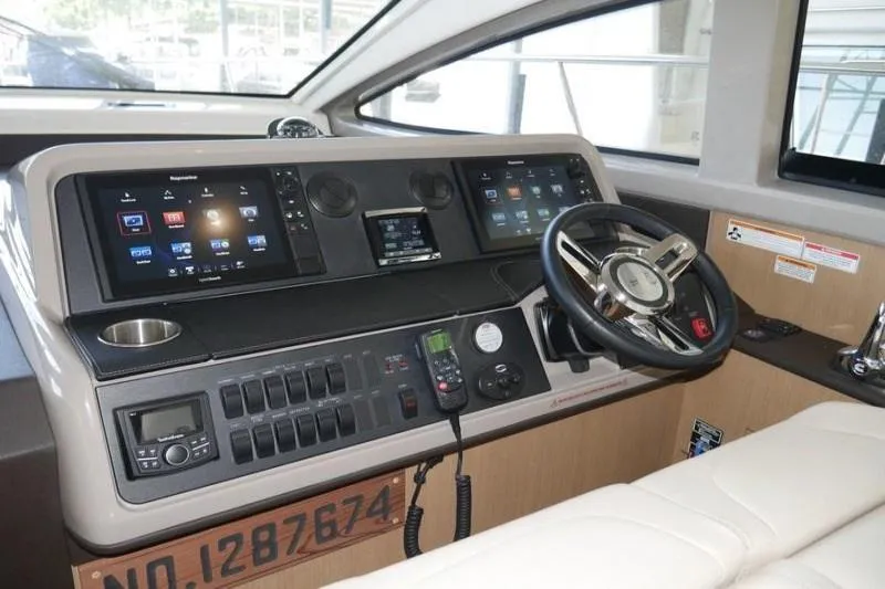 Necessity Yacht Photos Pics 2017 Sea Ray Fly 400 helm with modern navigation controls and steering wheel.
