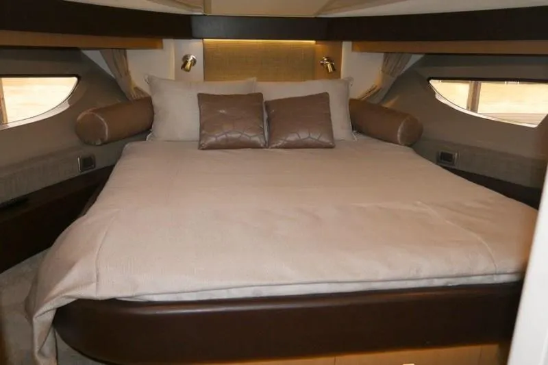 Necessity Yacht Photos Pics Luxurious bedroom interior of 2017 Sea Ray Fly 400 yacht with elegant bedding.