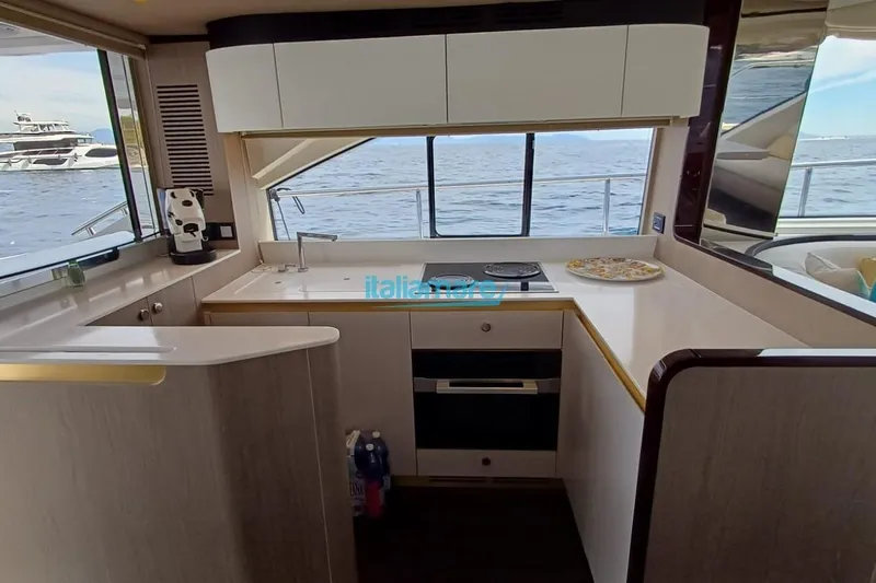  Yacht Photos Pics Modern kitchen interior of 2025 Azimut Fly 60 yacht with sea view.