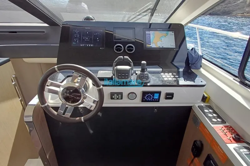  Yacht Photos Pics Cockpit of 2025 Azimut Fly 60 yacht with modern navigation controls and steering wheel.
