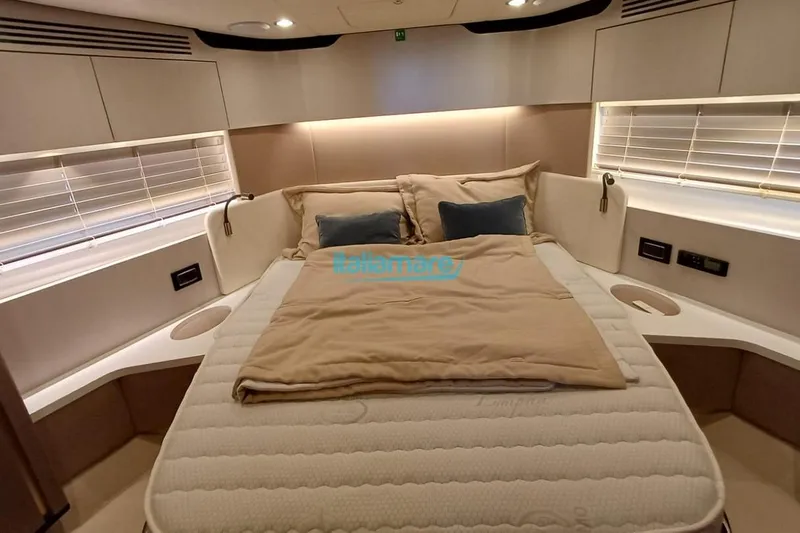  Yacht Photos Pics Luxurious bedroom interior of 2025 Azimut Fly 60 yacht with elegant bedding and modern design.