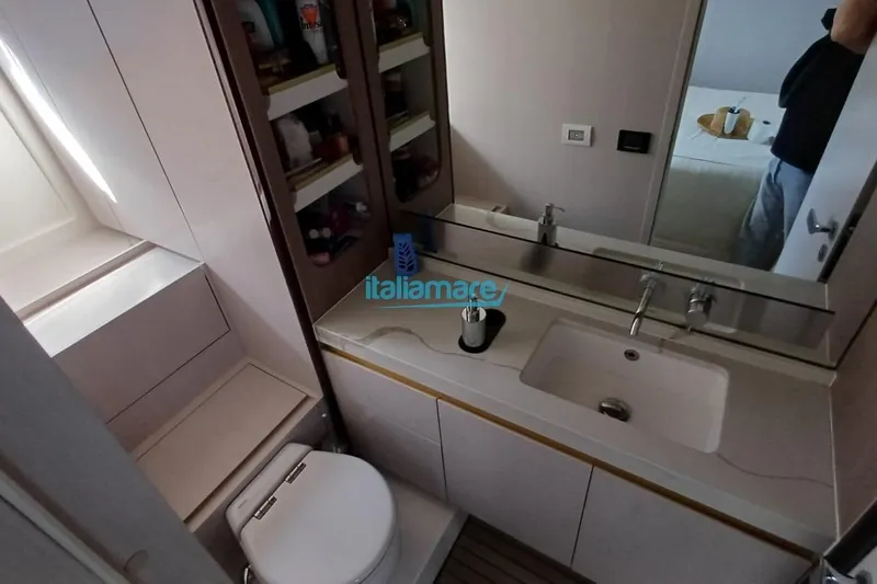  Yacht Photos Pics Bathroom interior of 2025 Azimut Fly 60 yacht, featuring modern sink and storage.