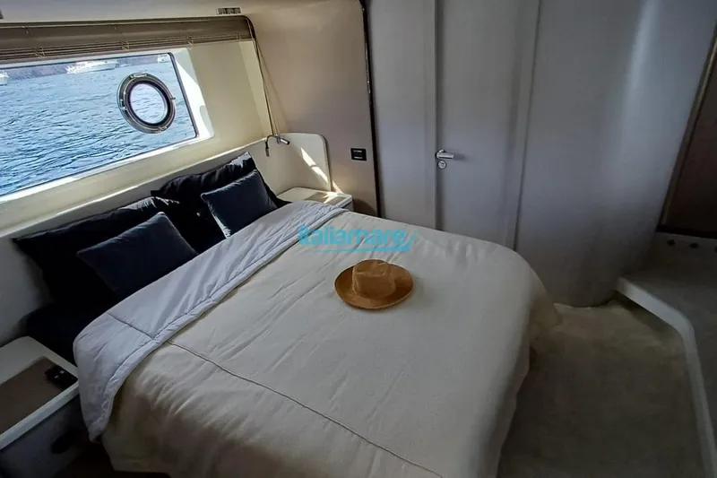  Yacht Photos Pics Luxurious bedroom interior of 2025 Azimut Fly 60 yacht with ocean view.