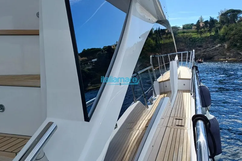  Yacht Photos Pics 2025 Azimut Fly 60 yacht deck with scenic coastal view.