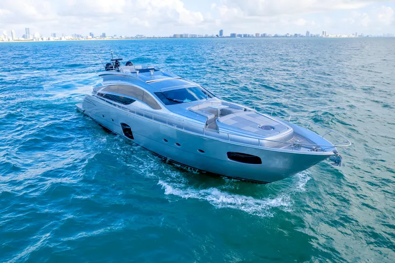  Yacht Photos Pics Luxurious 2013 Pershing 82 yacht cruising on open sea under clear skies.