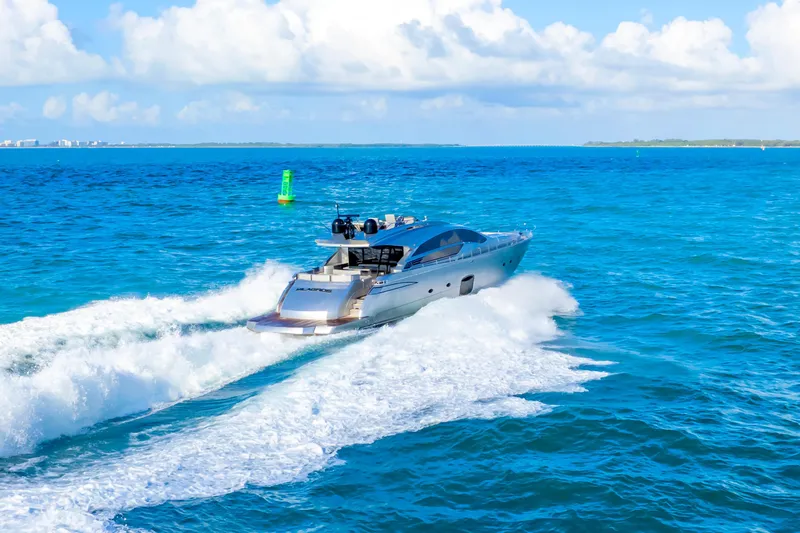  Yacht Photos Pics Luxury Pershing 82 yacht cruising on blue ocean waters, 2013 model.