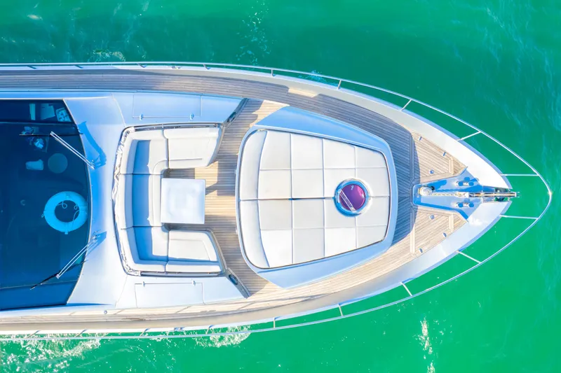  Yacht Photos Pics Aerial view of 2013 Pershing 82 yacht on turquoise water.