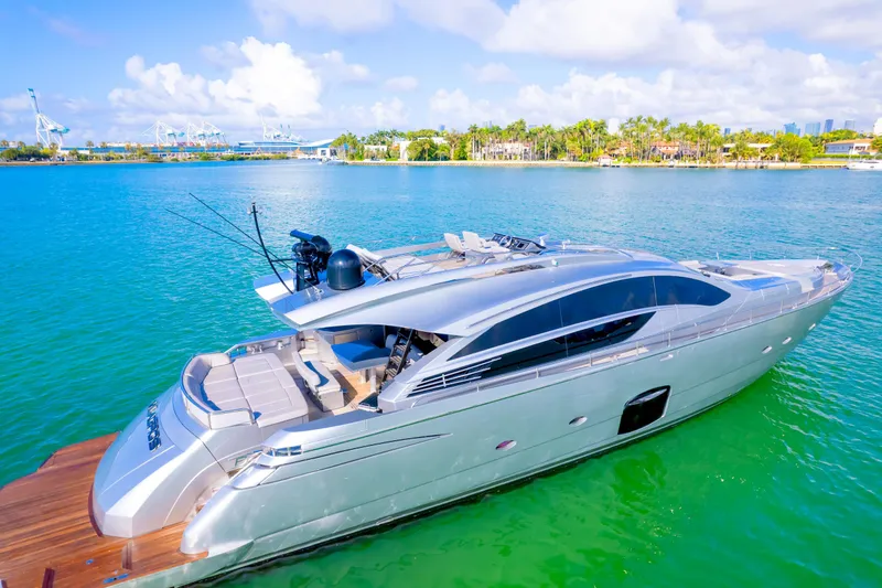  Yacht Photos Pics Luxurious 2013 Pershing 82 yacht cruising on turquoise waters under a clear sky.