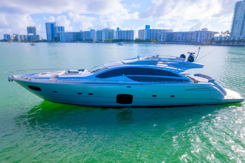  Yacht Photos Pics Luxurious 2013 Pershing 82 yacht cruising in sunny coastal waters.