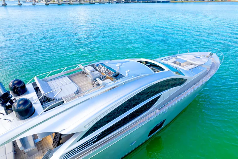  Yacht Photos Pics Luxurious 2013 Pershing 82 yacht on vibrant turquoise water, showcasing sleek design and spacious deck.