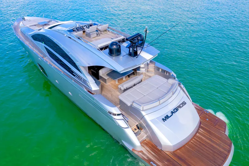  Yacht Photos Pics Luxurious 2013 Pershing 82 yacht cruising on clear turquoise waters.