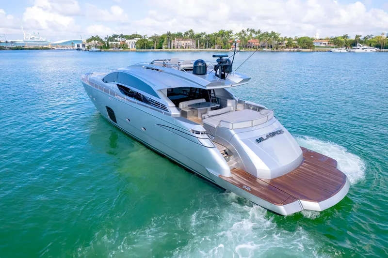  Yacht Photos Pics Luxury 2013 Pershing 82 yacht cruising on clear blue water.