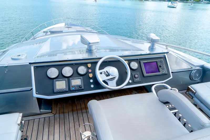  Yacht Photos Pics Cockpit of 2013 Pershing 82 yacht with modern controls and steering wheel.