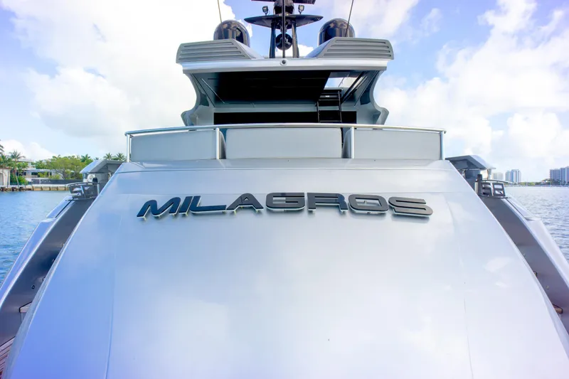  Yacht Photos Pics 2013 Pershing 82 yacht "Milagros" on water, showcasing sleek design and luxury features.