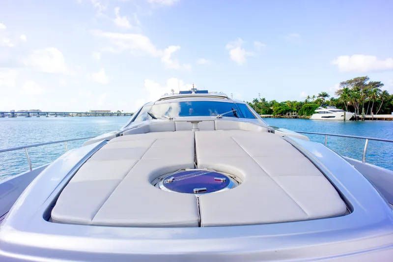  Yacht Photos Pics Luxury Pershing 82 yacht deck view, 2013 model, on serene blue waters.