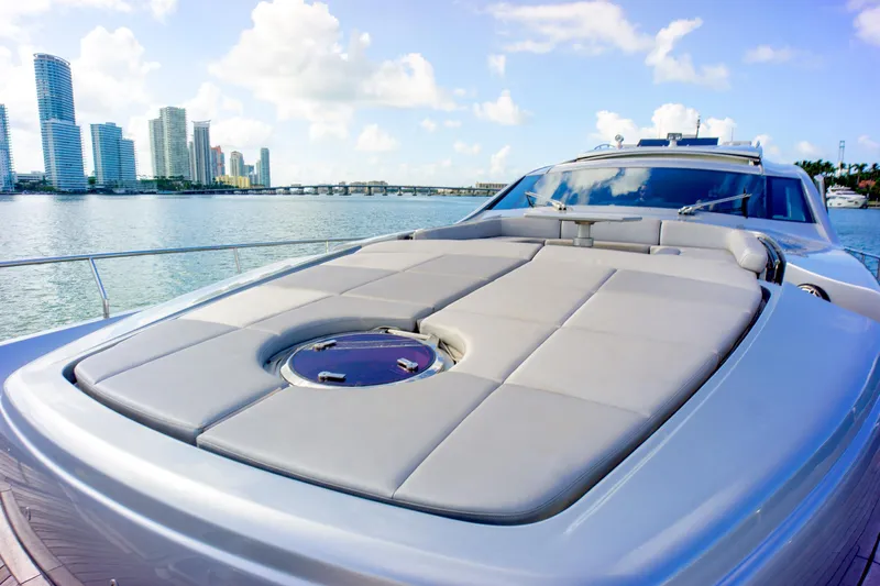  Yacht Photos Pics Luxury 2013 Pershing 82 yacht with sun deck, city skyline in background.
