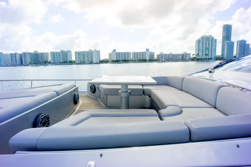  Yacht Photos Pics Luxurious 2013 Pershing 82 yacht with spacious deck seating and city skyline view.