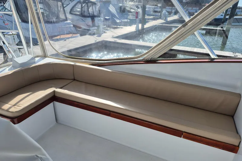 M.a.c. Daddy Yacht Photos Pics Interior seating of 2005 Custom Carolina 40 DeSanti boat, docked with marina view.