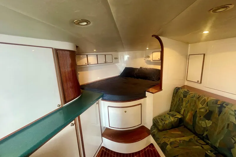 M.a.c. Daddy Yacht Photos Pics Interior of 2005 Custom DeSanti Carolina Express boat with cozy cabin and seating area.