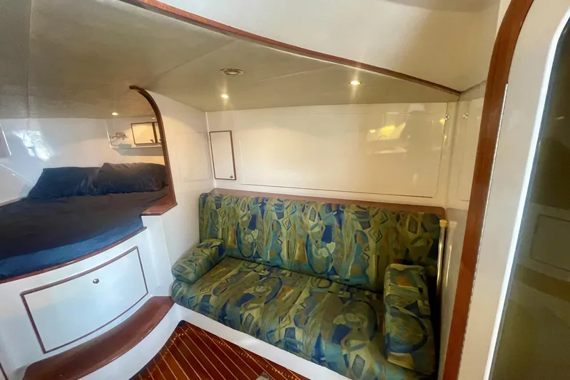 M.a.c. Daddy Yacht Photos Pics Interior of 2005 Custom DeSanti Carolina Express with cozy seating and sleeping area.