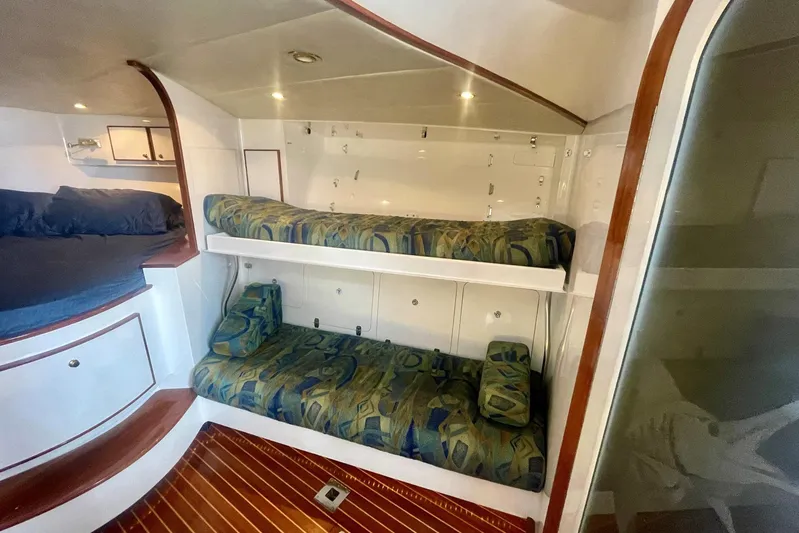M.a.c. Daddy Yacht Photos Pics Interior of 2005 Custom DeSanti Carolina Express with bunk beds and wood accents.