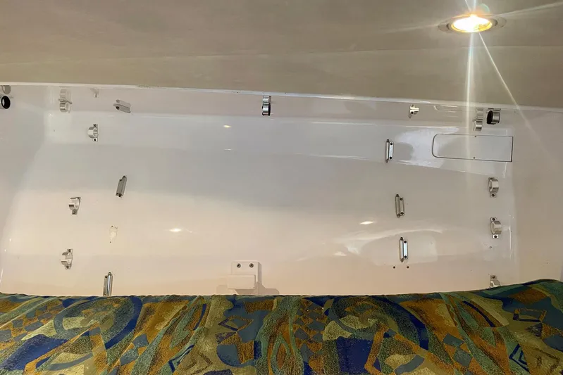 M.a.c. Daddy Yacht Photos Pics Interior of 2005 Custom DeSanti Carolina Express boat with patterned upholstery and mounted fixtures.