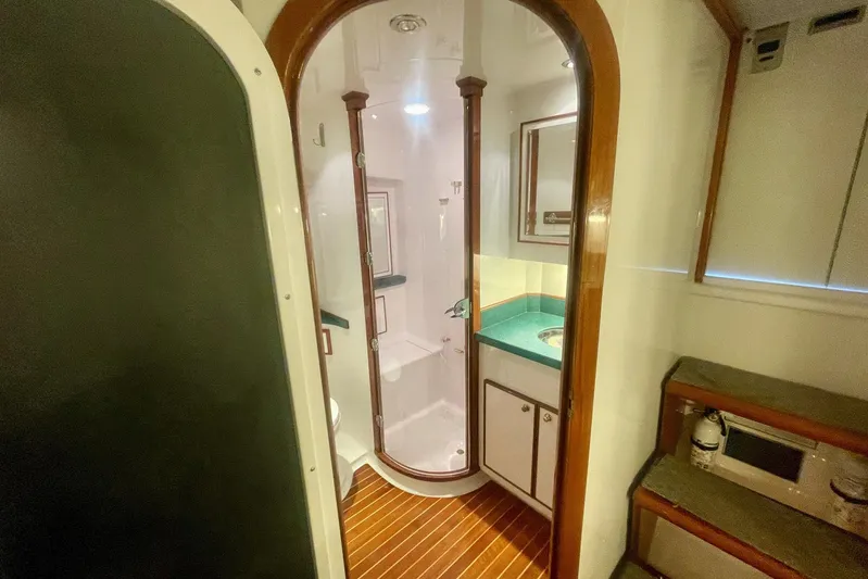 M.a.c. Daddy Yacht Photos Pics Luxurious 2005 DeSanti Carolina Express yacht bathroom with wood accents and modern fixtures.