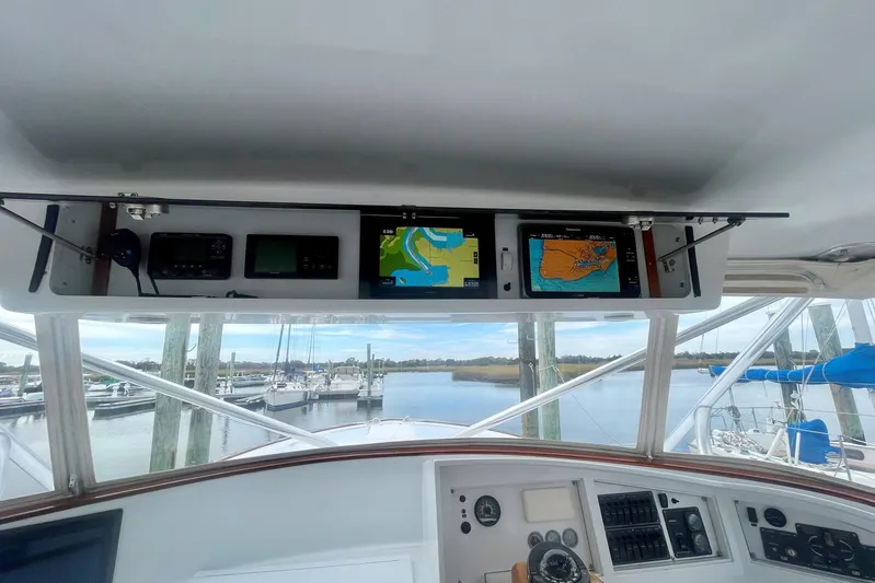 M.a.c. Daddy Yacht Photos Pics 2005 Custom DeSanti Carolina Express boat dashboard with navigation screens at marina.