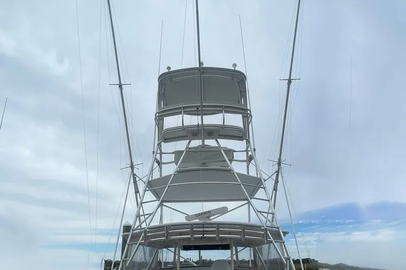 M.a.c. Daddy Yacht Photos Pics Custom 2005 DeSanti Carolina Express boat tower against cloudy sky.