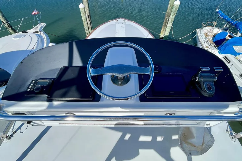 M.a.c. Daddy Yacht Photos Pics Helm of 2005 Custom DeSanti Carolina Express boat with steering wheel and controls.