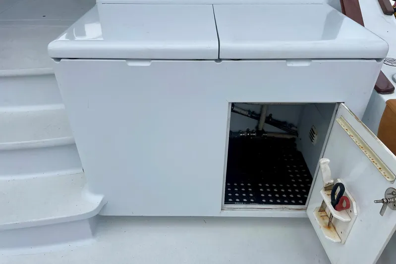 M.a.c. Daddy Yacht Photos Pics Open storage compartment on 2005 Custom DeSanti Carolina Express boat deck.